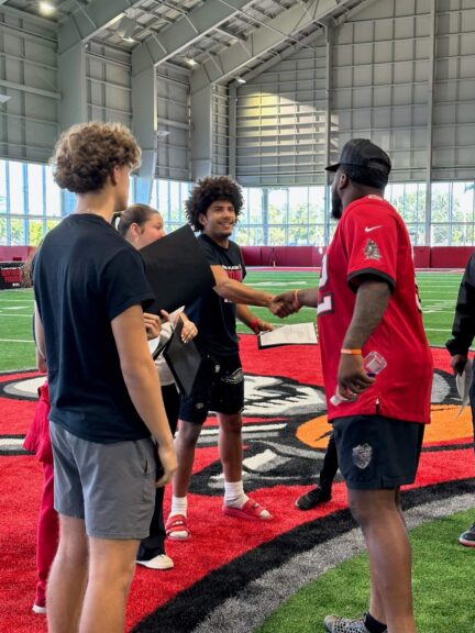 TBFK and Buccaneers handshake image